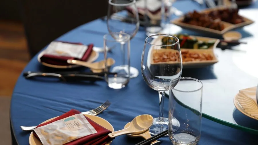 Close-up of stemless wine glasses on a dining table with natural light and blurred background