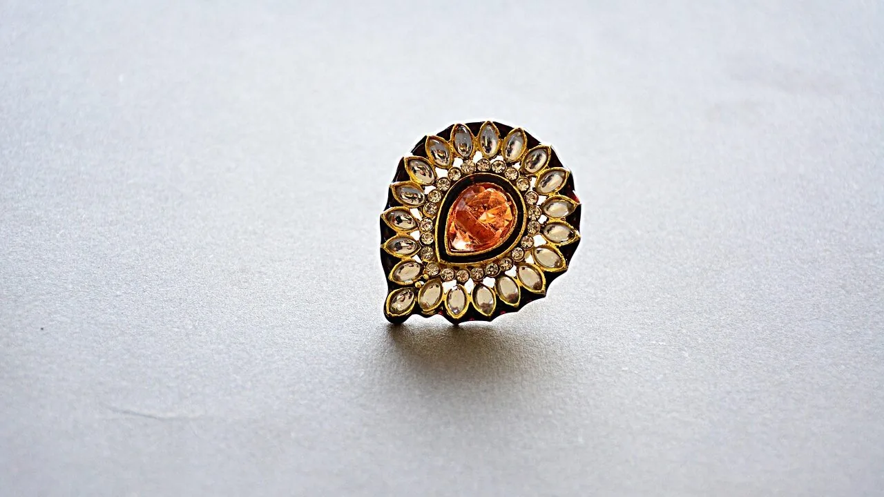 Close-up of various stud earrings displayed on white background showing different styles and designs