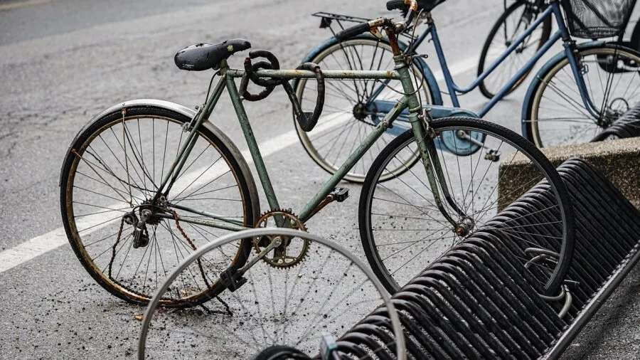 Close-up of worn bicycle pannier showing material durability and patina from daily urban commuting use