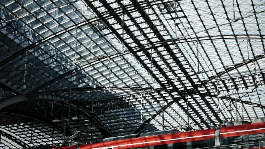 Close-up view of vehicle roof showing factory mounting rails and hardware for rack installation