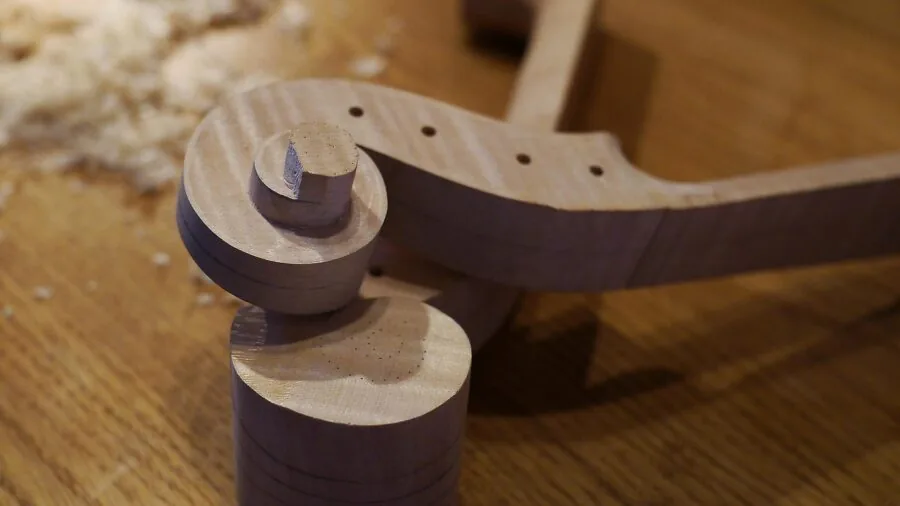 Close-up view of violin wood grain and construction showing spruce tonewood craftsmanship