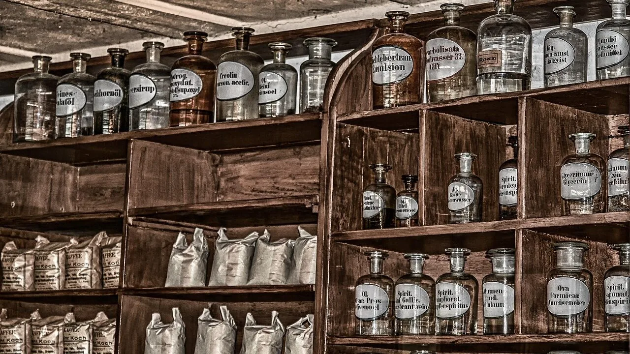 Collection of dry shampoo spray bottles displayed on bathroom shelf with natural lighting
