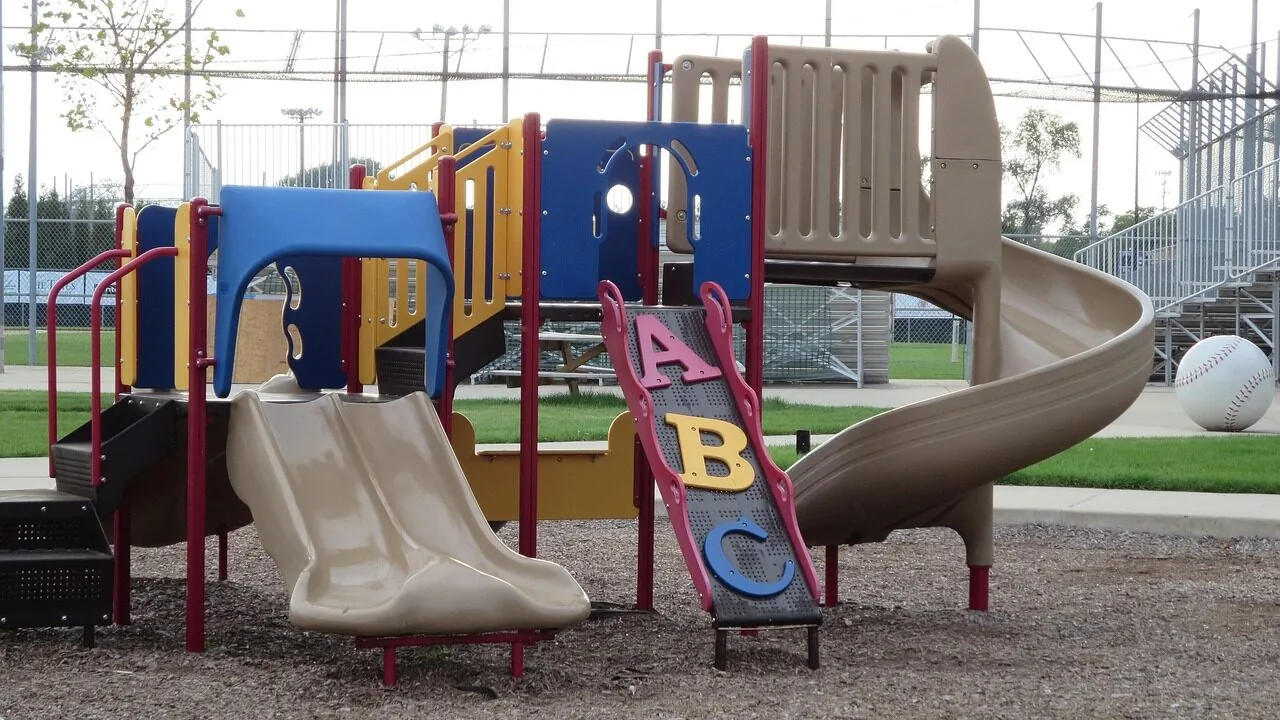 Colorful kids slide in sunny backyard setting