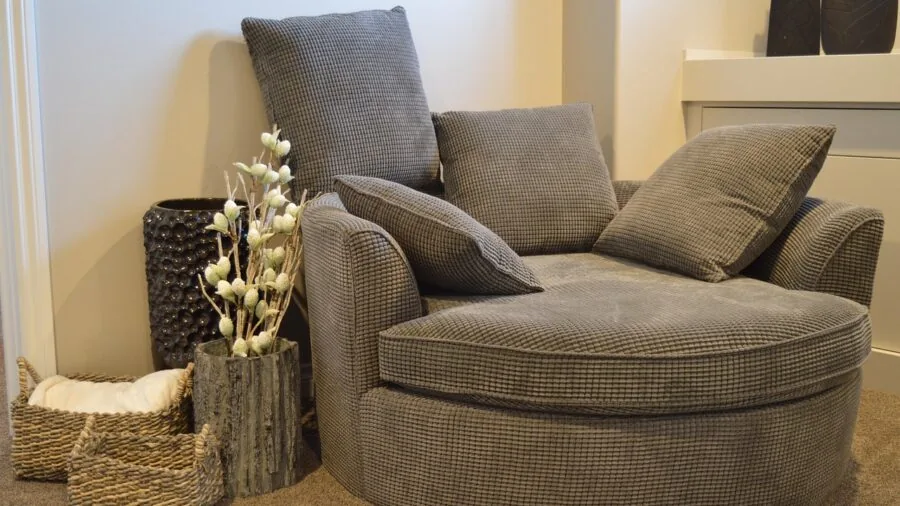 Comfortable living room with multiple decorative pillows arranged on a sofa in a cozy home setting