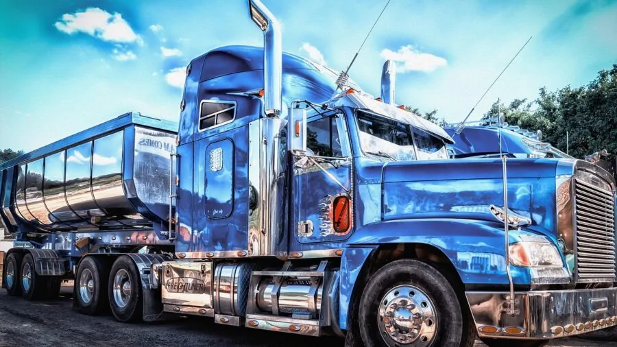 Commercial truck driver reviewing vehicle safety documentation and compliance standards