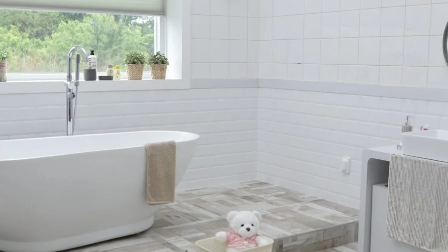 Compact bathroom interior showing limited floor space between toilet and vanity sink