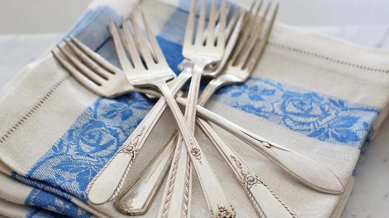 Complete dinnerware sets arranged on dining table with plates, bowls, and cups