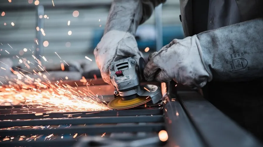 Construction worker wearing properly fitted safety glasses while working on job site
