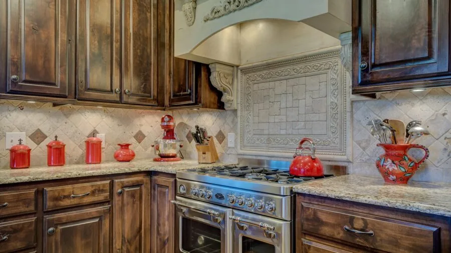 Contemporary kitchen featuring polished stainless steel appliances and fixtures in a home setting