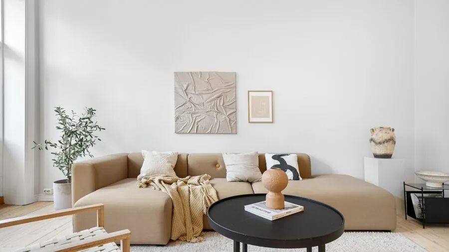 Contemporary living room with minimalist decor and neutral tones, showing a comfortable home interior space