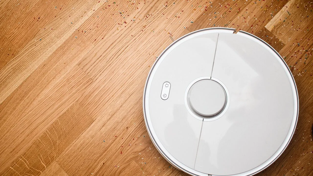 Cordless vacuum cleaner in use on hardwood floor