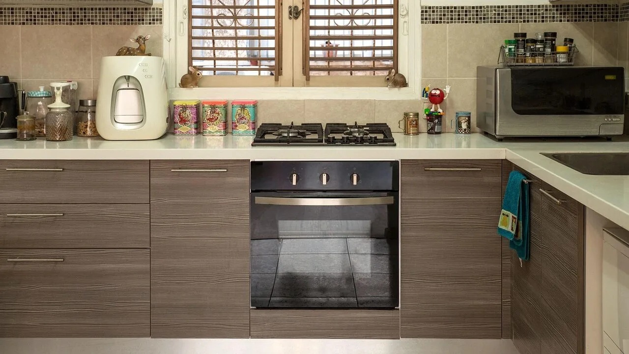 Countertop microwave oven on kitchen counter with natural lighting