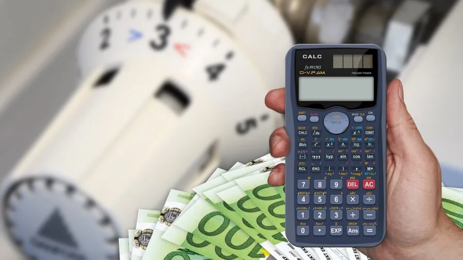 Craftsman reviewing tool maintenance expenses and long-term equipment costs at workbench