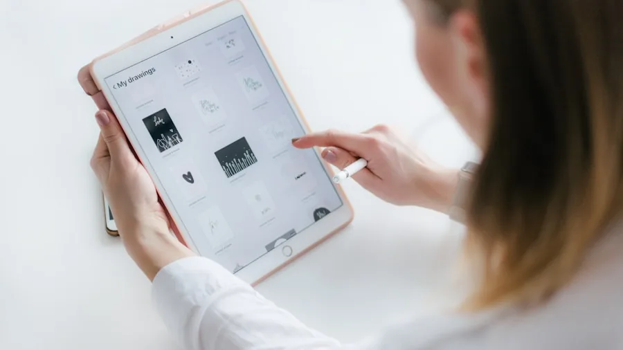 Creative professional editing digital photos on a tablet device in a bright workspace