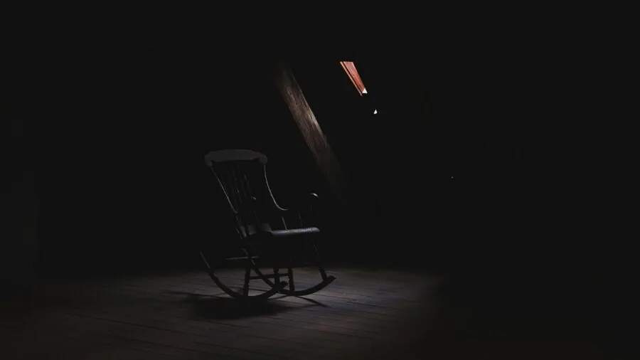 Dark gaming room with LED indicators glowing in dim lighting environment
