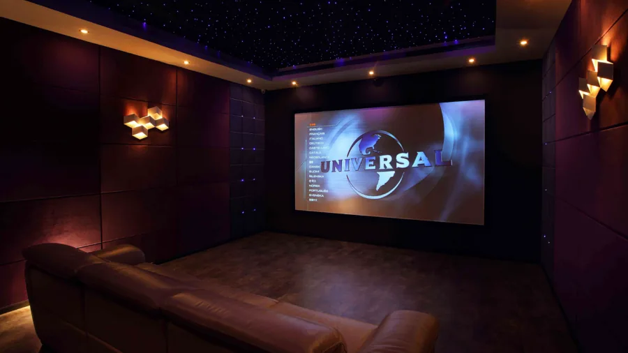 Dark home theater room with ambient lighting setup for optimal viewing experience