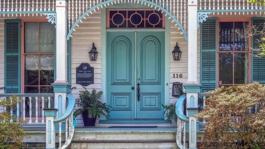 Different residential door styles including hinged and sliding doors in a modern home entryway