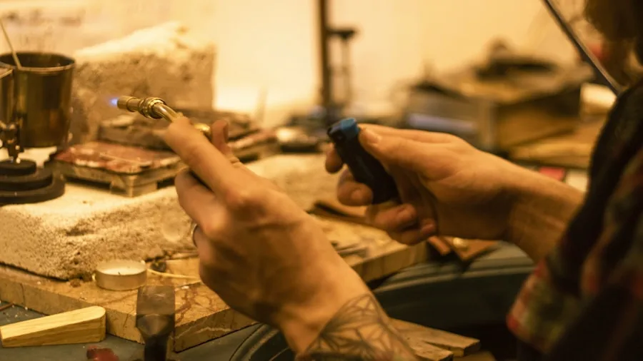 DIY enthusiast using cordless tools for creative craft project at wooden workbench
