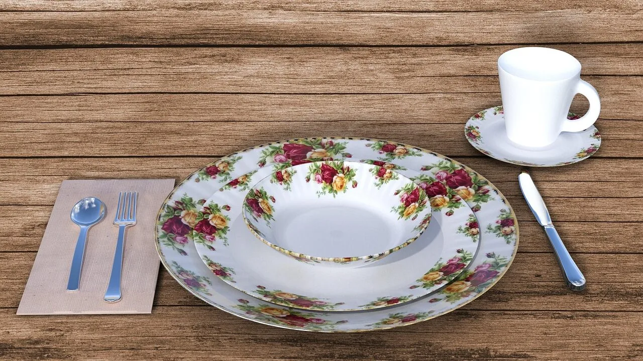 Elegant porcelain dinnerware sets arranged on dining table with place settings