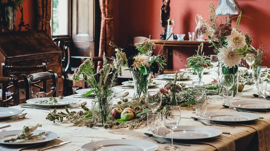 Elegant table setting with silverware and dinnerware on a formal dining table