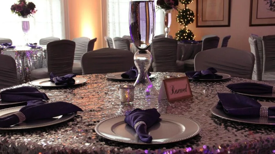 Elegant white dinnerware set displayed on a wooden table during a casual meal setting