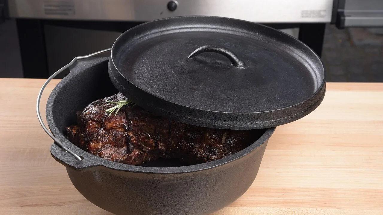 Enameled cast iron dutch oven on stovetop ready for cooking
