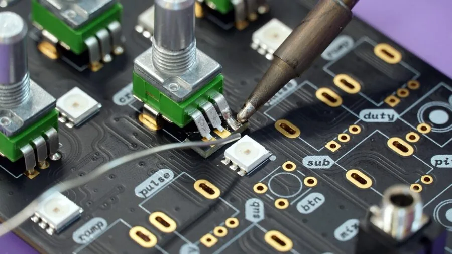 Engineer examining technical specifications at workbench with tools and equipment