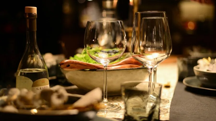 Family enjoying a meal together at a dining table, representing quality dinnerware durability and lasting value