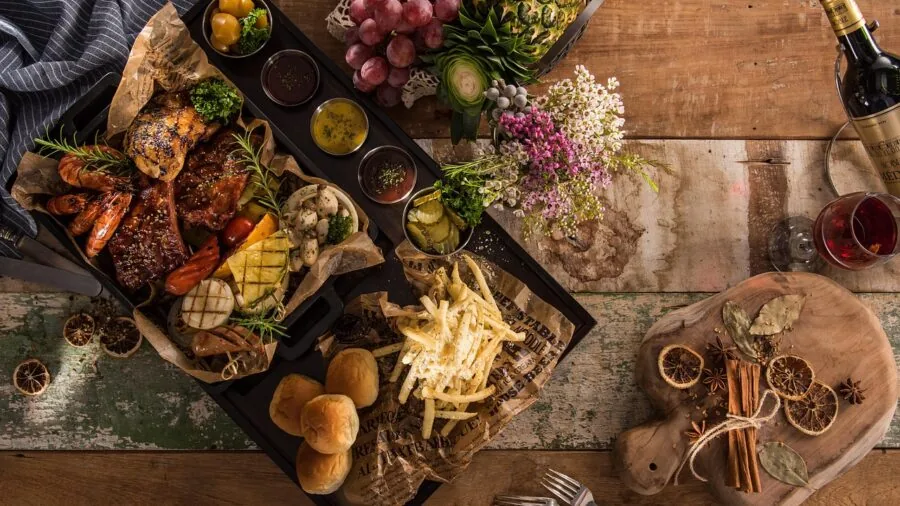 Family gathered around dining table sharing food and conversation during meal time