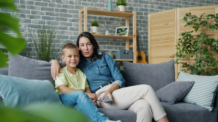 Family gathered in living room watching TV, demonstrating real-world home entertainment viewing experience