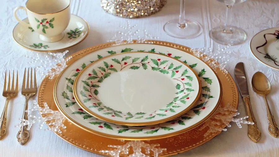 Family of four enjoying a casual meal together at a dining table with place settings