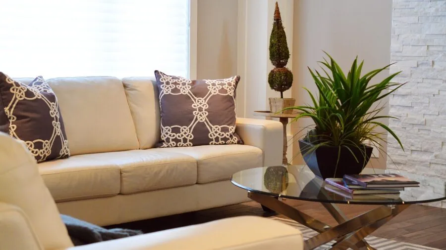 Family relaxing together on a comfortable sectional sofa in a bright living room with natural light