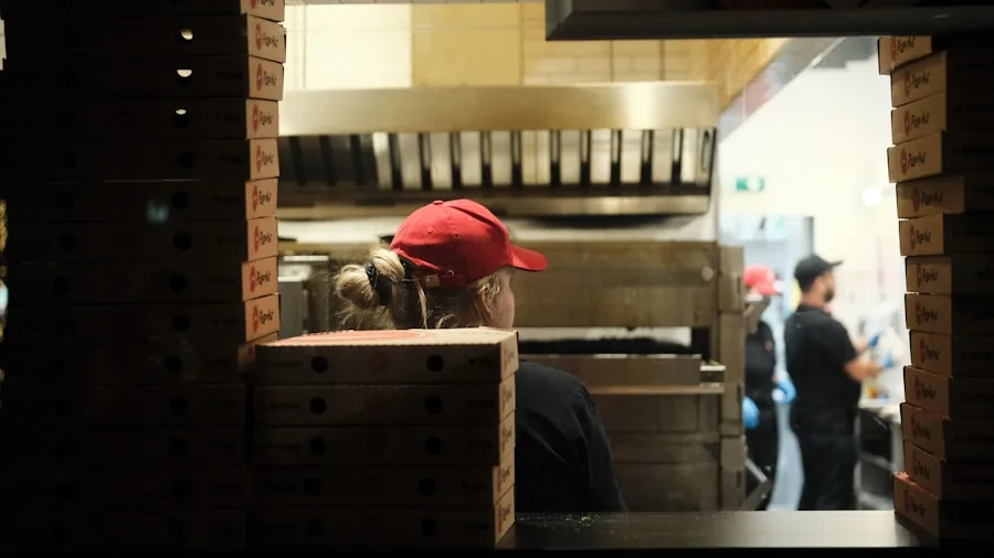 Fast-paced commercial kitchen with staff efficiently managing multiple tasks during service