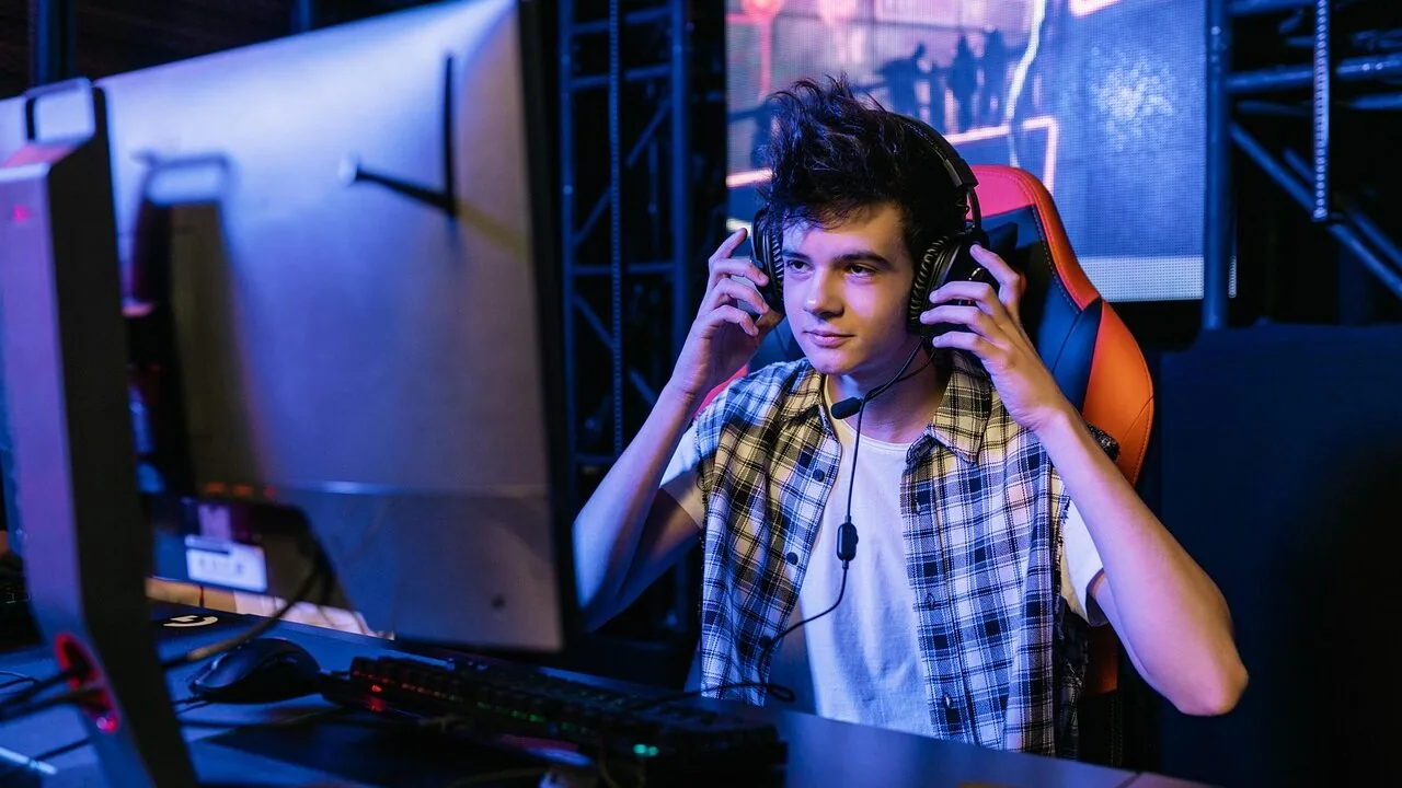 Gaming headsets displayed on desk with computer setup