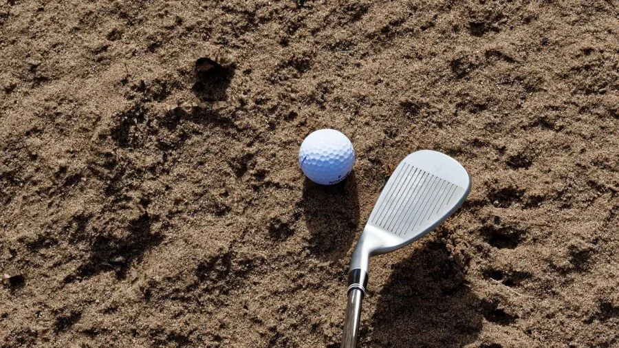 Golfer on course demonstrating wedge shot technique with multiple distance markers visible