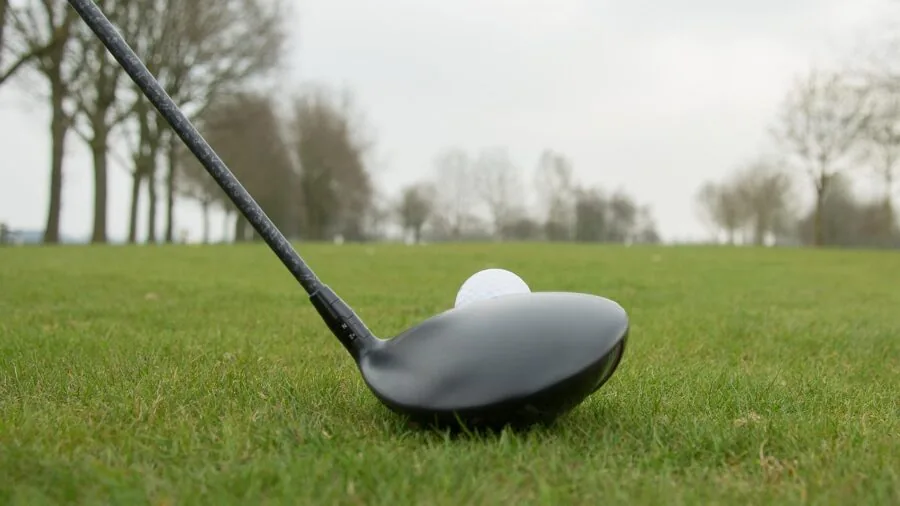 Golfer's hands demonstrating proper grip and club control during swing
