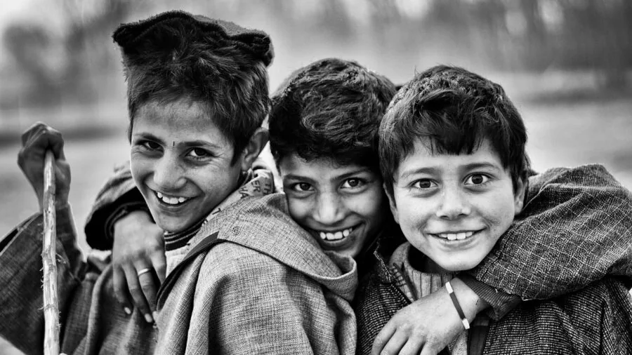 Group of happy kids playing games together indoors, smiling and enjoying time with friends