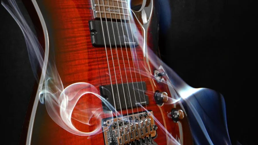 Guitarist's hands adjusting foot pedals during live performance setup
