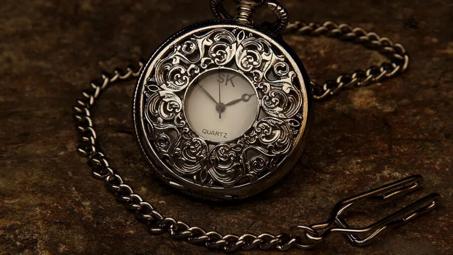 Hands holding an inherited timepiece, showing family heirloom and lasting value across time