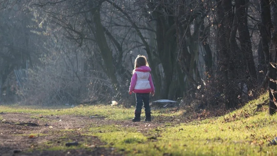 Happy kids playing outdoors in natural sunlight, enjoying active time in nature for vitamin D exposure