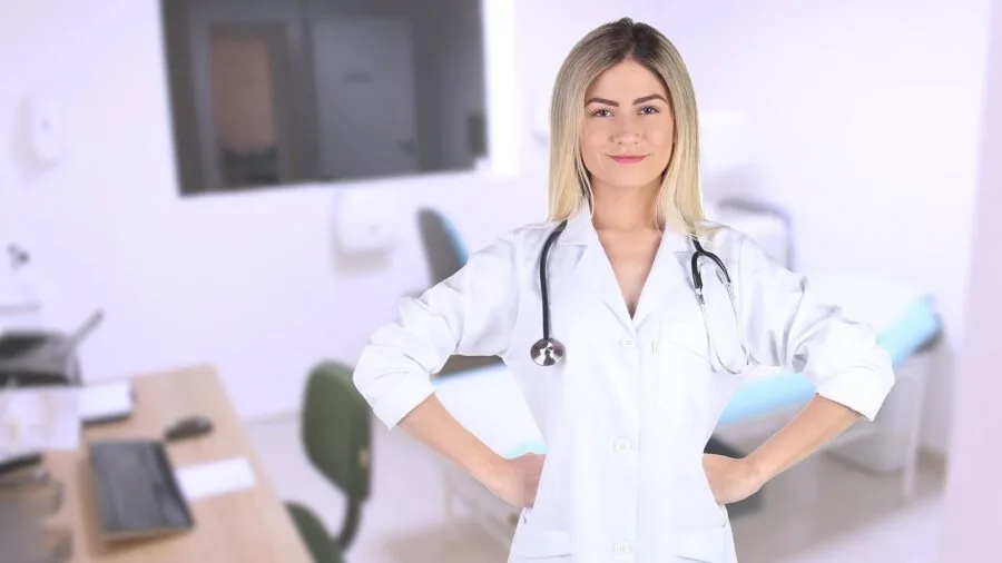 Healthcare professional in white coat working in medical environment