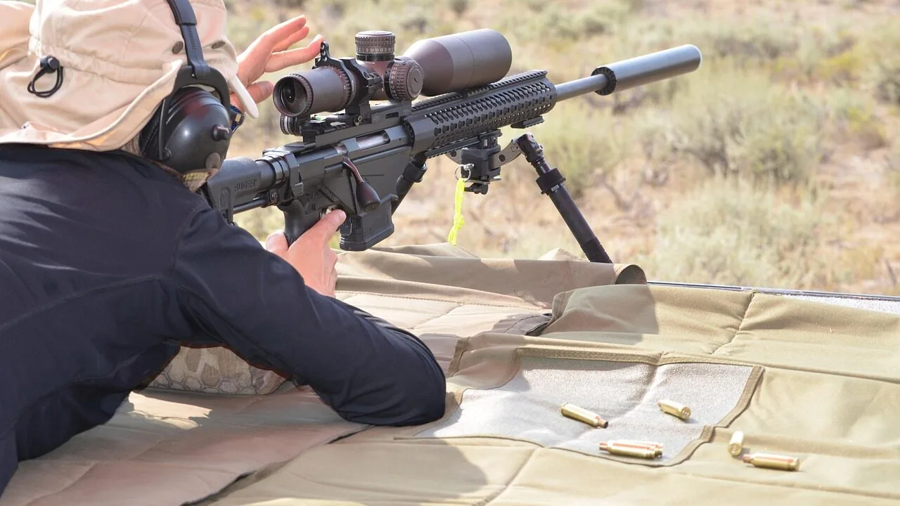 High-quality rifle scope mounted on rifle barrel in close-up view