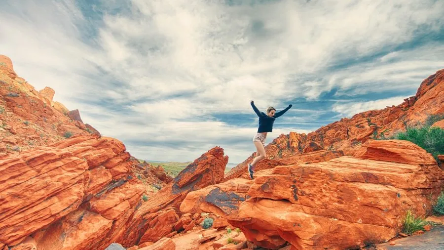 Hiker in mountain landscape demonstrating outdoor activity performance demands