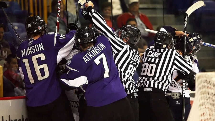 Hockey player in action taking a shot on ice during game with dynamic motion and intensity