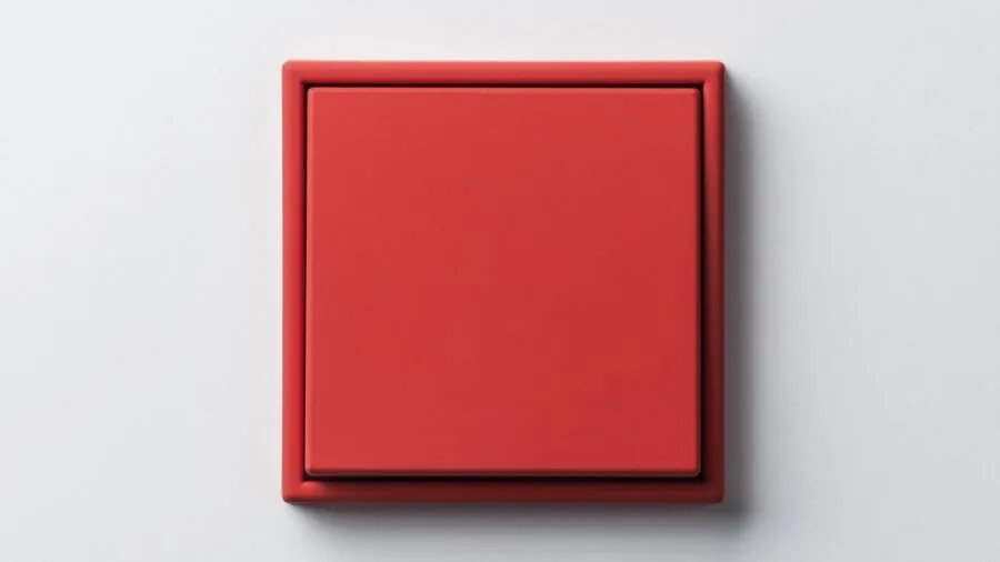 Homeowner installing a wall switch during DIY home improvement project in modern living space