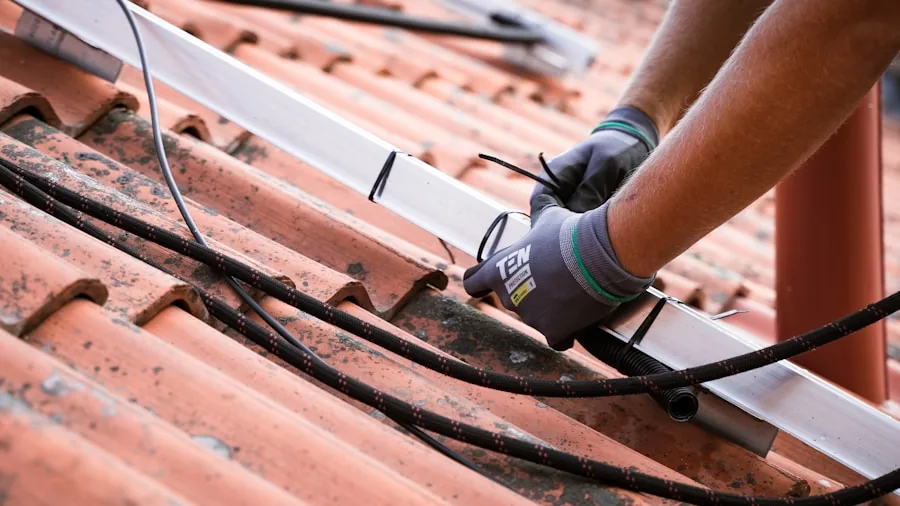 Homeowner installing antenna on residential rooftop for optimal TV signal reception