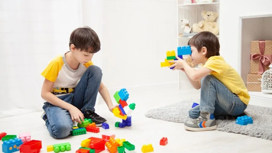 Infant exploring textures during tummy time with colorful sensory toys for early developmental learning