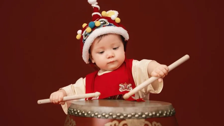 Infant stacking and learning with soft colorful blocks during playtime development