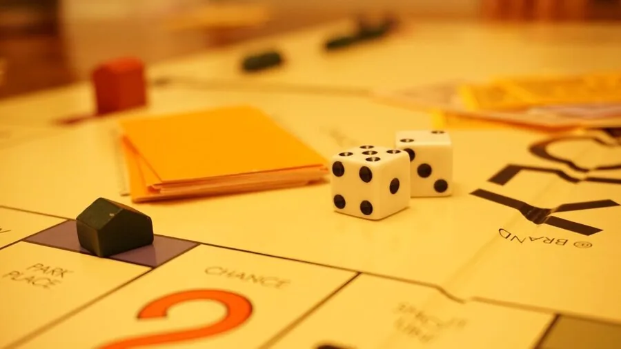 Kids engaged in creative cooperative board game play, demonstrating thematic imagination and collaborative fun