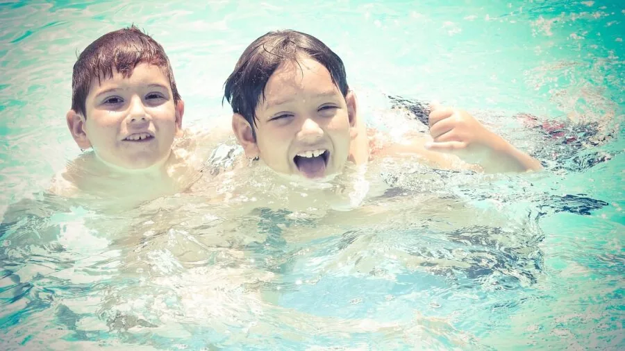 Kids enjoying a sturdy inflatable pool during summer outdoor playtime